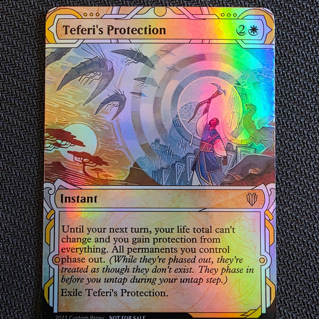 Macro shot of a foil Teferi's Protection proxy catching the light