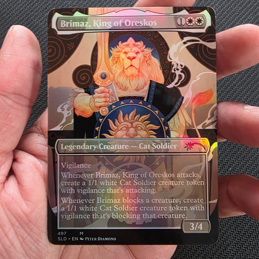 A finished foil proxy card held up to show print quality